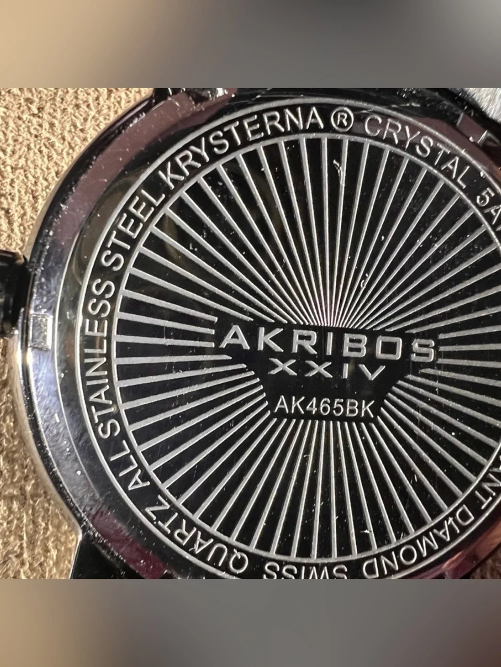 Akribos XXIV Black and Silver Radiant Caseback Watch